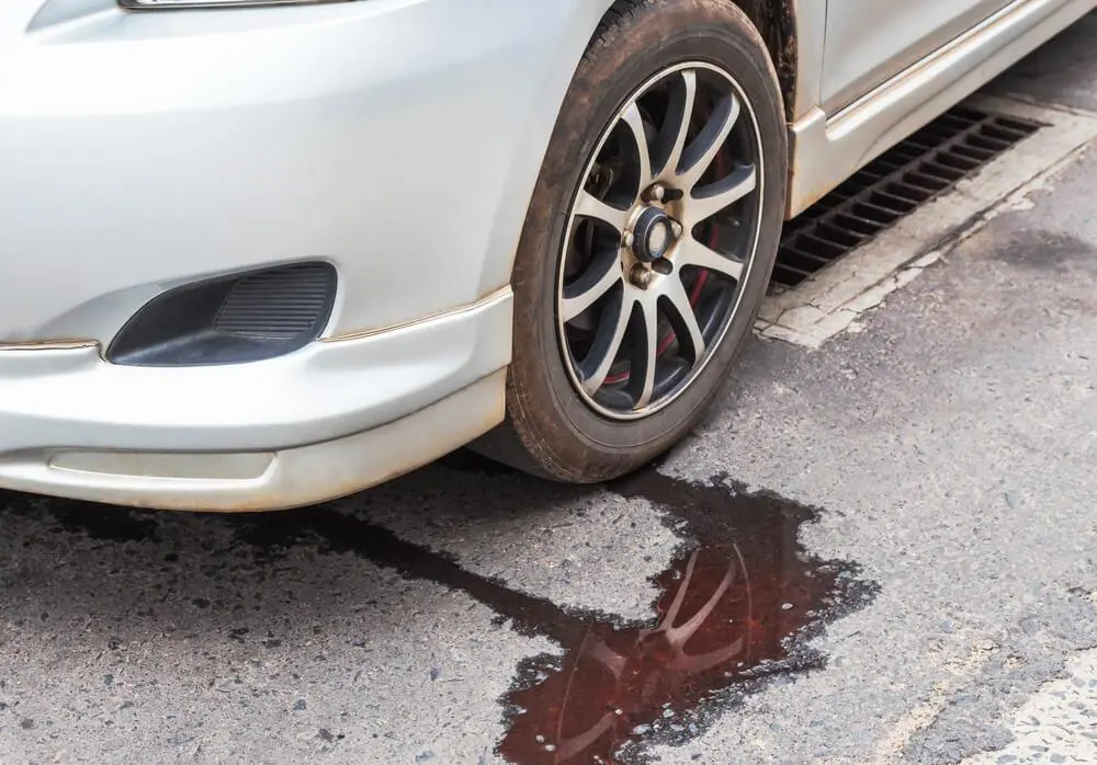 Transmission fluid leaking from car